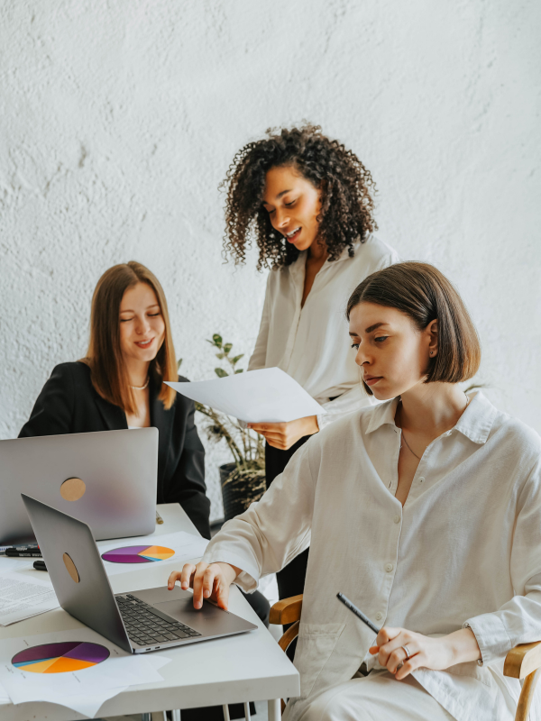 Women on laptops at work